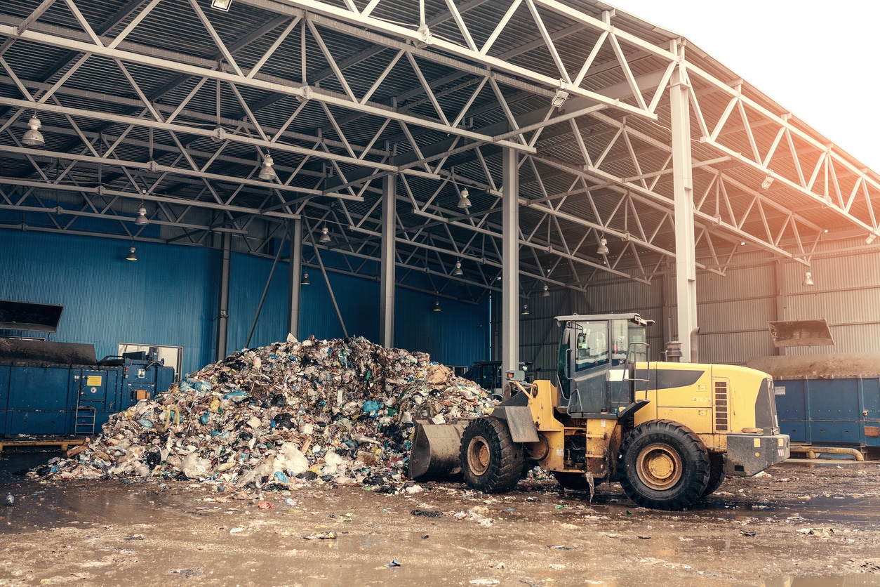 Bulldozer Cleaning Manufacturing Waste At The Waste Processing Plant